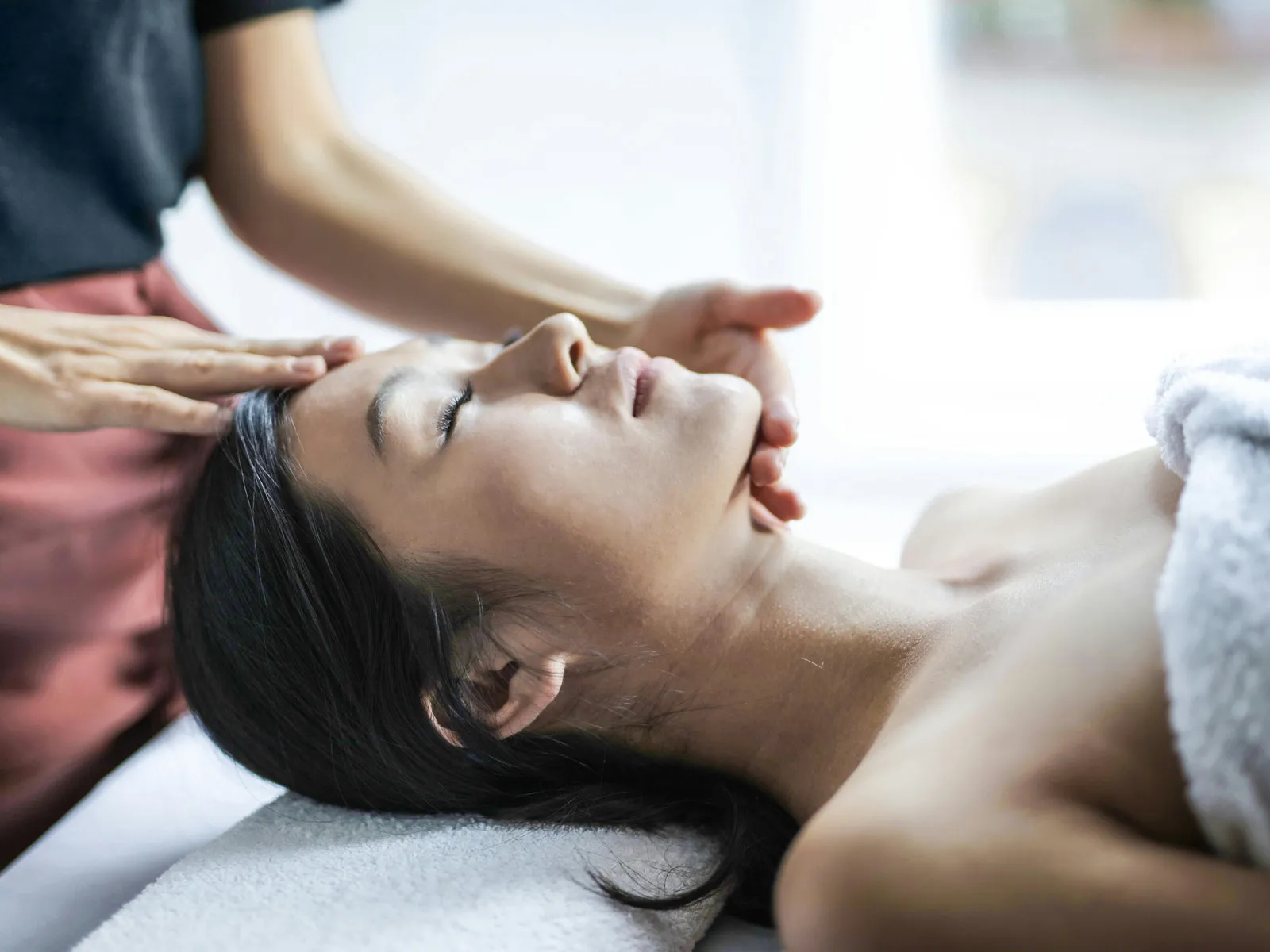 Relaxing head and face massage wrapped in a warm towel at Forest Spa